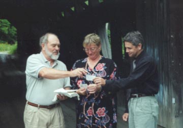 Bill McKone presents VCBS memberships to Susan Bartlett and Rich Westman.