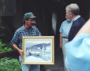 Eric Tobin presents his painting of the Junction Bridge to the Senator.