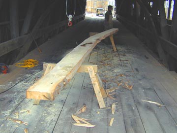 Village Bridge - The curved-grain Spruce timber is shaped and ready to be fit into the Burr- arch