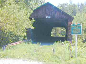 Hammond Bridge only a chain between two posts Photo by Joe Nelson Aug. 19, 2003