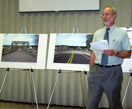 Dave Kennicutt, Delta engineer, shows the before and after designs of the Main Street Bridge