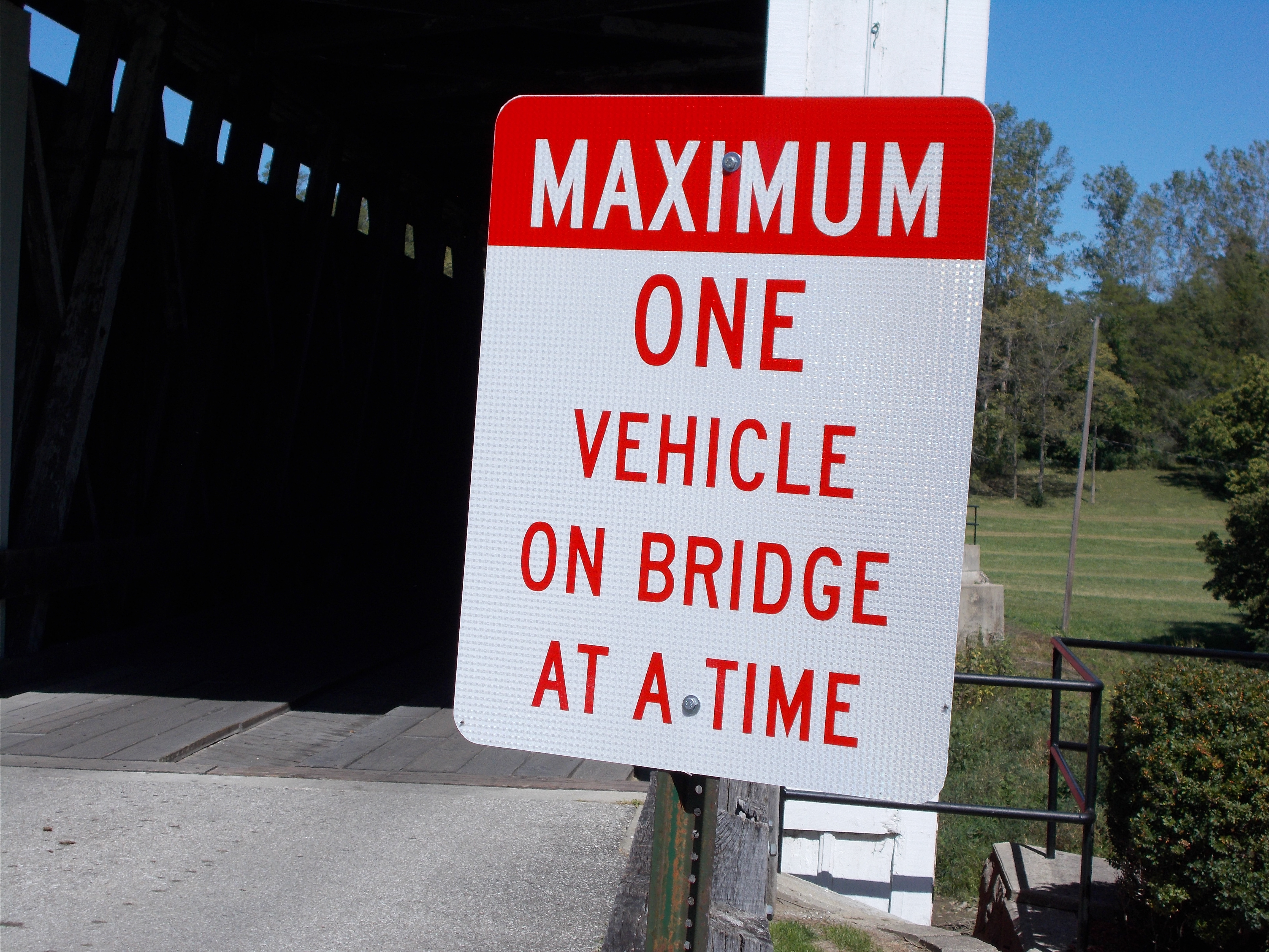 One vehicle crossing sign